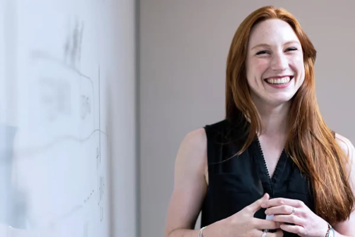 woman beside an whiteboard